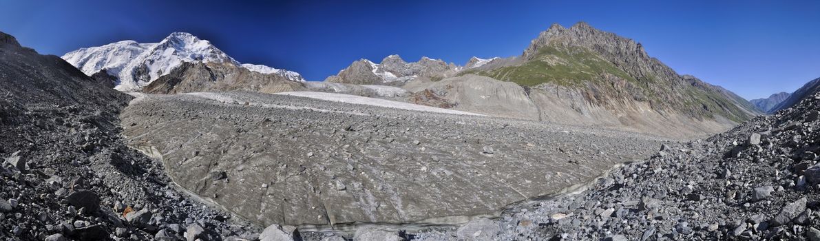 Scenic panorama of glacier and highest peaks in Tien-Shan mountain range in Kyrgyzstan