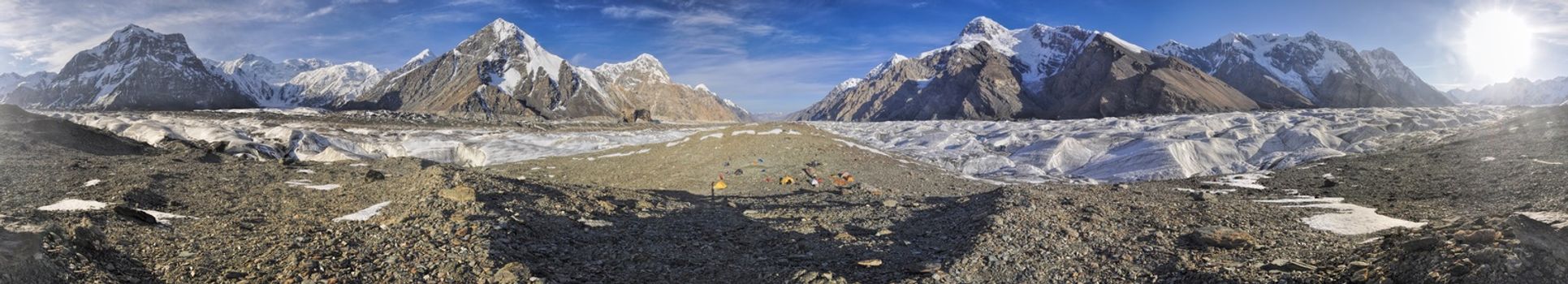 Scenic panorama of campsite on Engilchek glacier in picturesque Tian Shan mountain range in Kyrgyzstan