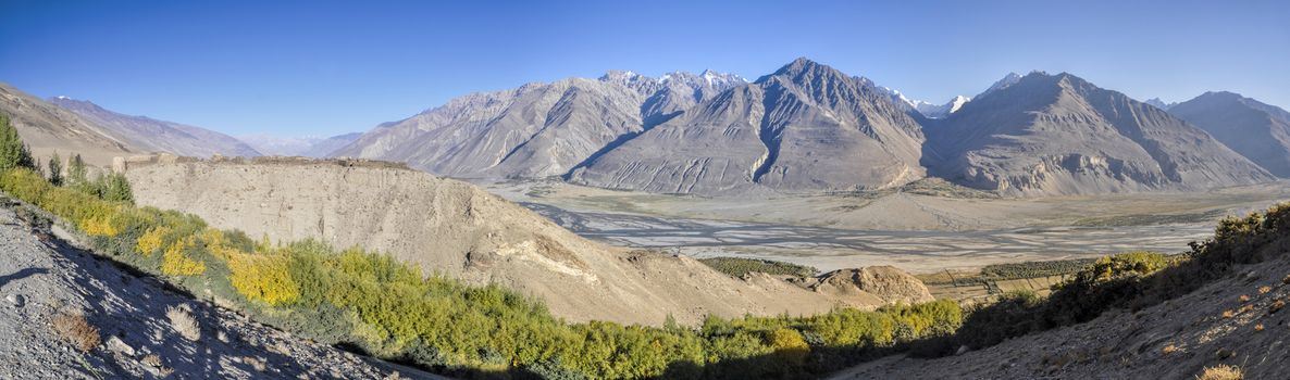 Scenic panorama of valley on arid landscape in Tajikistan on sunny day