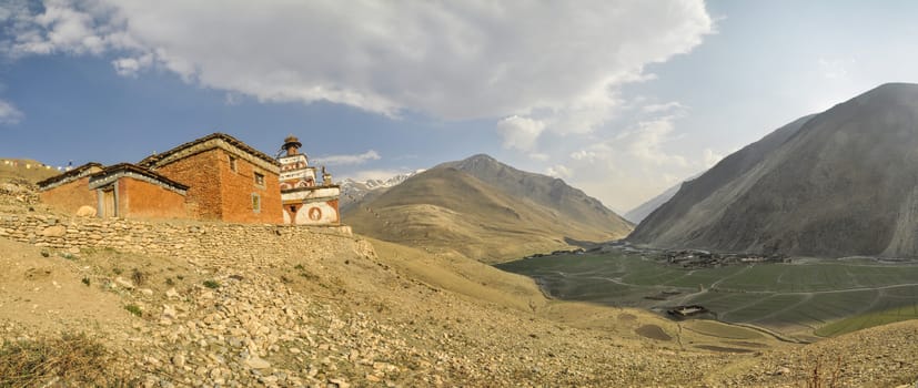 Scenic panorama of buddhist monastery above valley in Dolpo region in Nepal