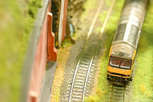 miniature express train on a model railroad set