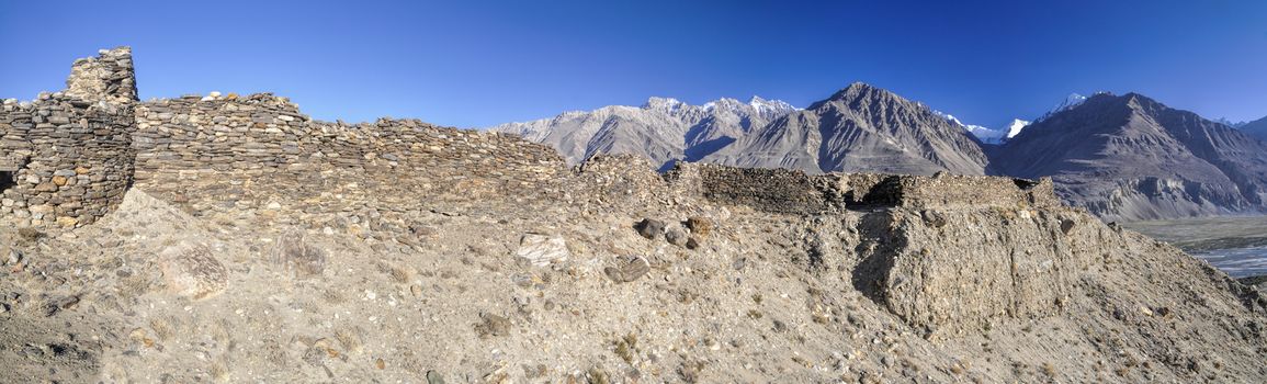 Scenic panorama of old ruins on arid landscape in Tajikistan on sunny day