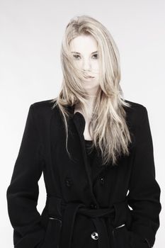 Portrait of a Young Woman with Blond Hair and Black Coat