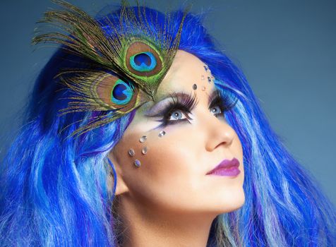 Portrait of a Woman in Blue Wig and Peacock Feathers