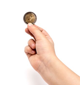 Two euro coin in child hand