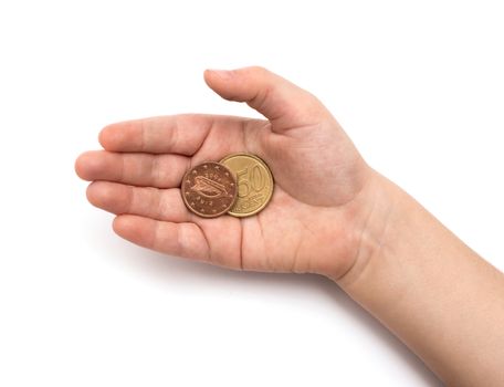 Coins in child's hand on white background