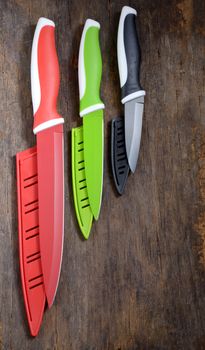 ceramic knifes on old wooden table

