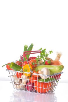 Assortment of fresh vegetables in metal basket