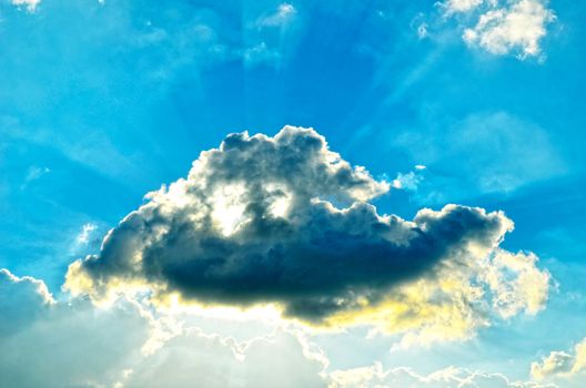 Blue sky with white cloud and sun