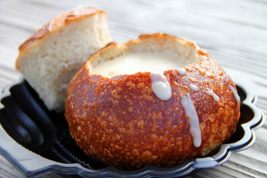 The most famous and popular in San Francisco mussel soup in a pot of bread