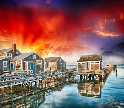 Wooden Homes over water. Beautiful view at summer sunset.