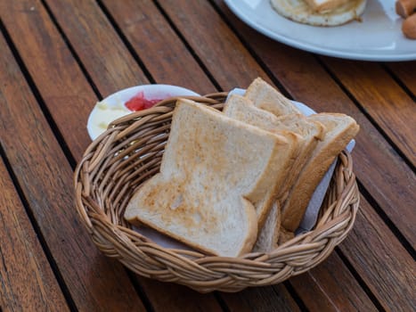 Baked bread in the basket for breakfast