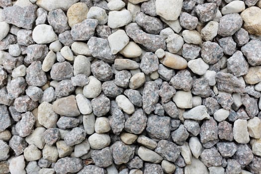 Grey and white crushed granite rock as an abstract texture background