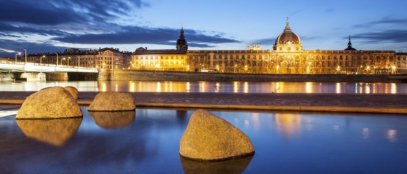 Panoramic view from Rhone river in Lyon city by night, France.