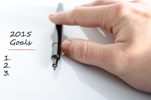 Pen in the hand isolated over white background