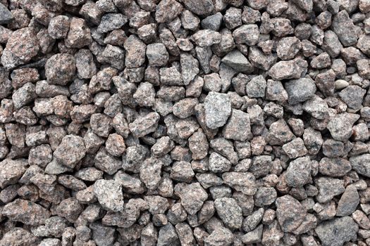 Crushed granite stone as an abstract background texture