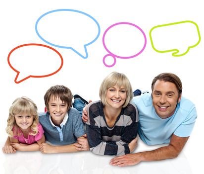 Smiling family of four with speech bubbles