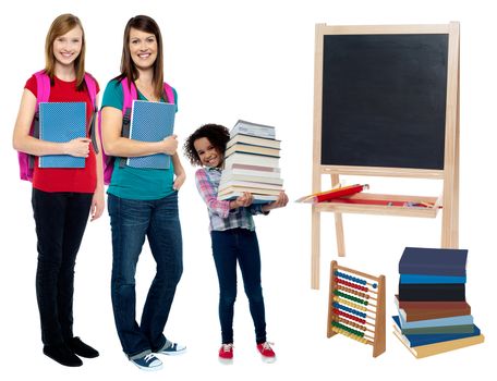 Students carrying textbooks and backpack