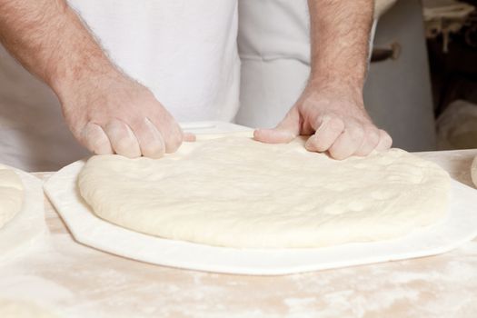 Professional Bakery - Baker Working with Dough.