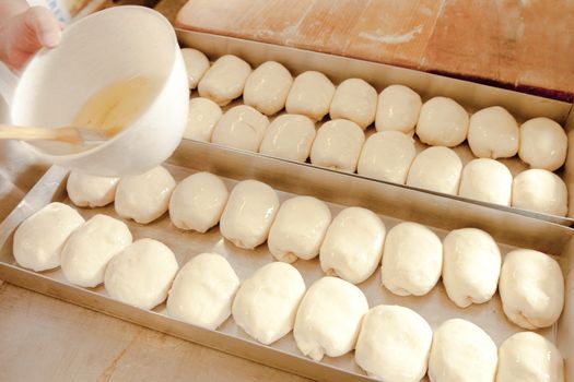 Professional Bakery - Brushing Egg Wash on Pastry