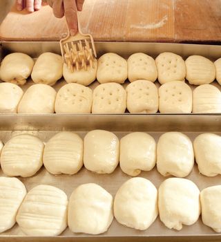 Professional Bakery - Finishing Touches on Pastry before Baking