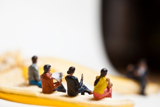 Miniature people in action in various situations