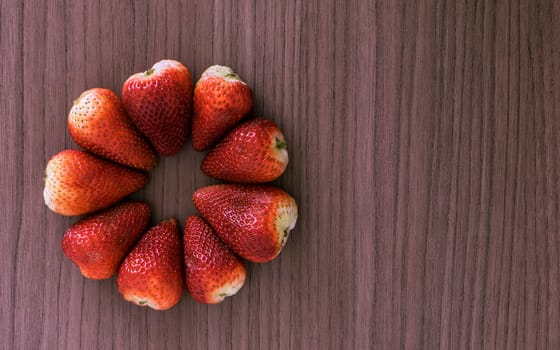 Nine strawberries arranged in flower shape