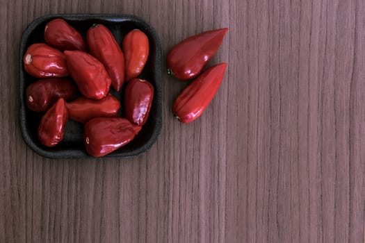 Many red chili in a black bowl