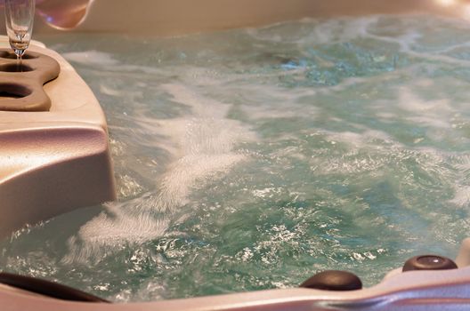 Close-up Jacuzzi, Jacuzzi with sparkling water and champagne glass.