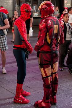 New York – Sept 2014: costumed superheroes and children's characters pose for photographs with Tourists on 42nd Street, Times Square on Sept 7, 2014 in New York, USA.