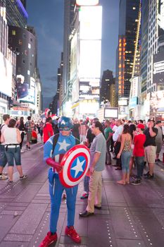 New York – Sept 2014: costumed superheroes and children's characters pose for photographs with Tourists on 42nd Street, Times Square on Sept 7, 2014 in New York, USA.
