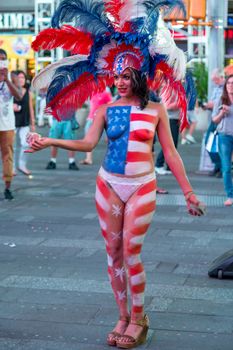 New York – Sept 2014: costumed superheroes and children's characters pose for photographs with Tourists on 42nd Street, Times Square on Sept 7, 2014 in New York, USA.