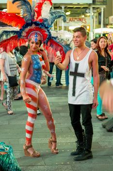 New York – Sept 2014: costumed superheroes and children's characters pose for photographs with Tourists on 42nd Street, Times Square on Sept 7, 2014 in New York, USA.