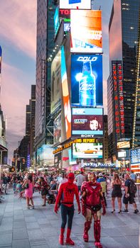 New York – Sept 2014: costumed superheroes and children's characters pose for photographs with Tourists on 42nd Street, Times Square on Sept 7, 2014 in New York, USA.