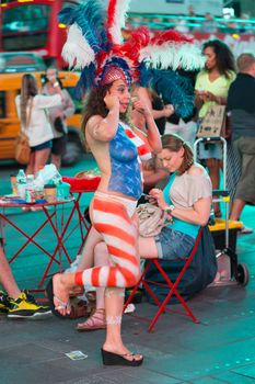 New York – Sept 2014: costumed superheroes and children's characters pose for photographs with Tourists on 42nd Street, Times Square on Sept 7, 2014 in New York, USA.