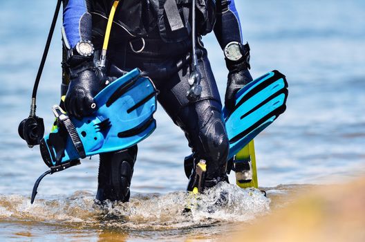 Scuba diver after the dive is beached