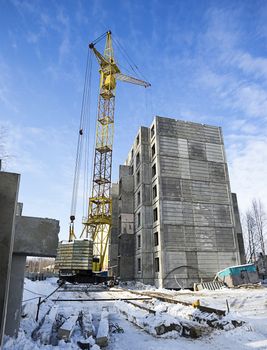A new multi-storey building with a tower crane.