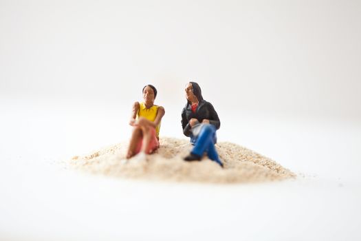 Miniature people in action in various situations