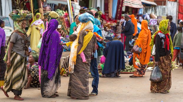 HARAR, ETHIOPIA - JULY 27,2014 - Local residents of Harar,considered as the fourth holy city of Islam, shopping in the street markets near the famous Shoa gate area.