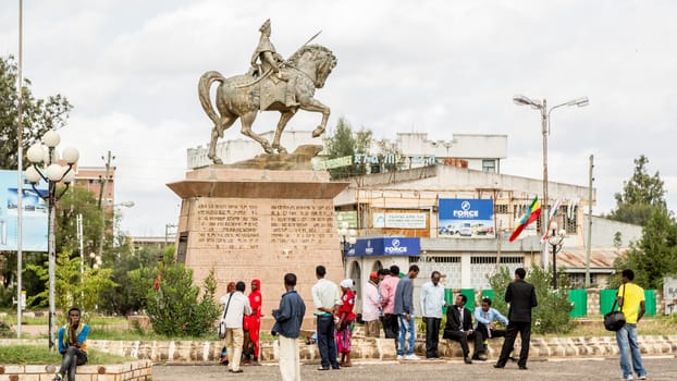 HARAR, ETHIOPIA - JULY 27,2014: Tourists gather around the statue of Ras Makonnen Wolde Michael Guddisa, father of Emperor Haile Selassie I (Tafari Makonnen), to have their pictures taken.