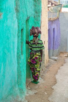 HARAR, ETHIOPIA - JULY 26,2014 - Local residents of Jugol, the fortified historic walled city within Harar, which was included in the World Heritage List for its cultural heritage by UNESCO and considered as the fourth holy city of Islam.