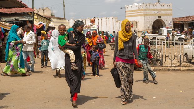 HARAR, ETHIOPIA - JULY 26,2014 - Local residents of Jugol, the fortified historic walled city within Harar, which was included in the World Heritage List for its cultural heritage by UNESCO and considered as the fourth holy city of Islam.