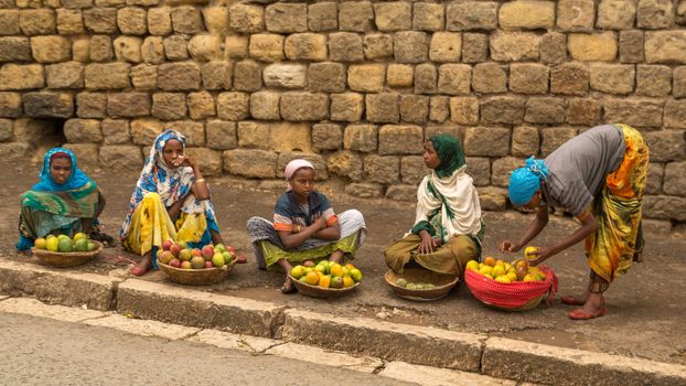 HARAR, ETHIOPIA - JULY 26,2014 - Local residents of Jugol, the fortified historic walled city within Harar, which was included in the World Heritage List for its cultural heritage by UNESCO and considered as the fourth holy city of Islam.