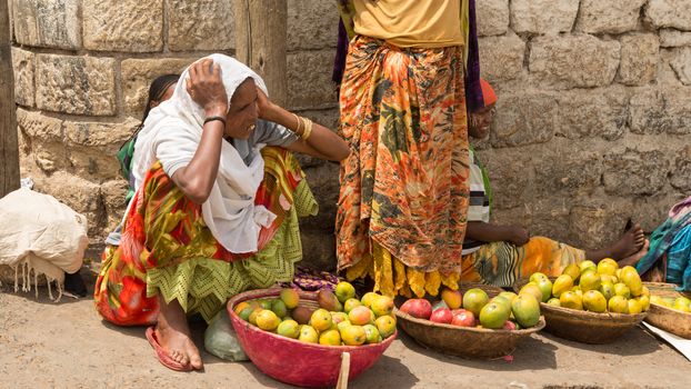 HARAR, ETHIOPIA - JULY 26,2014 - Local residents of Jugol, the fortified historic walled city within Harar, which was included in the World Heritage List for its cultural heritage by UNESCO and considered as the fourth holy city of Islam.