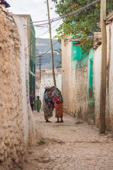 HARAR, ETHIOPIA - JULY 26,2014 - Local residents of Jugol, the fortified historic walled city within Harar, which was included in the World Heritage List for its cultural heritage by UNESCO and considered as the fourth holy city of Islam.
