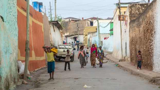 HARAR, ETHIOPIA - JULY 26,2014 - Local residents of Jugol, the fortified historic walled city within Harar, which was included in the World Heritage List for its cultural heritage by UNESCO and considered as the fourth holy city of Islam.