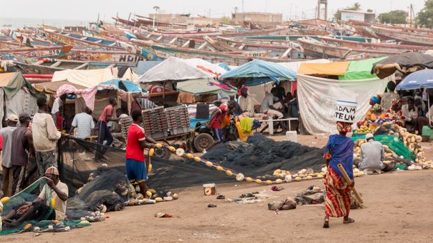 Mbour, Senegal - July, 2014: Fishermen set up their nets to go back to the see at the local fish market in Mbour on July 9, 2014 in Mbour, Senegal.