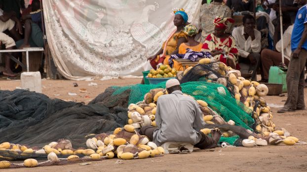 Mbour, Senegal - July, 2014: Fishermen set up their nets to go back to the see at the local fish market in Mbour on July 9, 2014 in Mbour, Senegal.