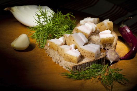 Sandwich with salted served with garlic, coarse salt and dill