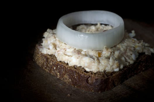 Forshmak (minced herring) on rye bread, light brush